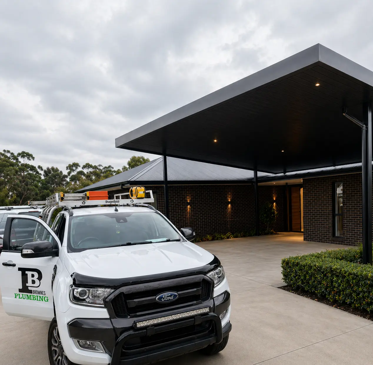 brownes plumbing service vehicle parked at residential property during roof plumbing work